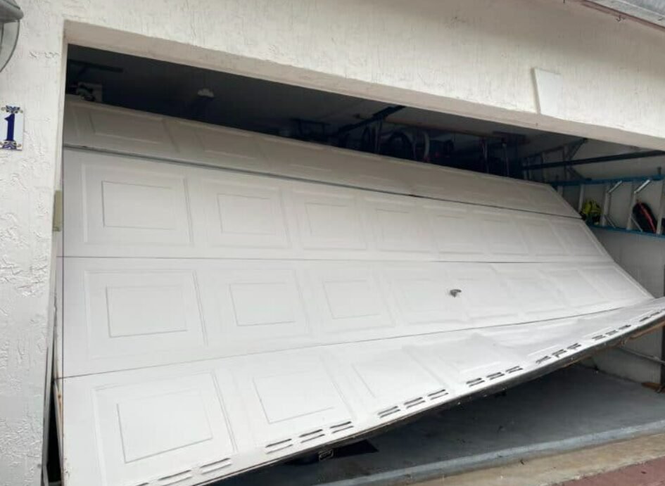 Professional technician performing garage door repair service in Osprey, highlighting expertise in fixing residential garage door issues